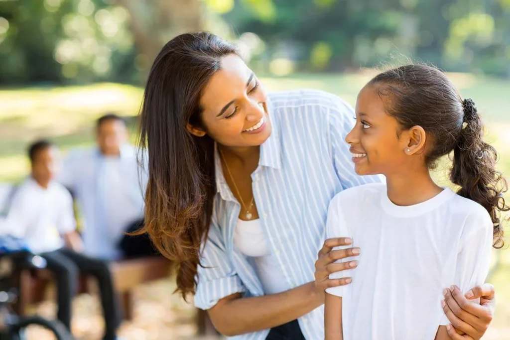 parent and young female child participating in occupational therapy activities for autism