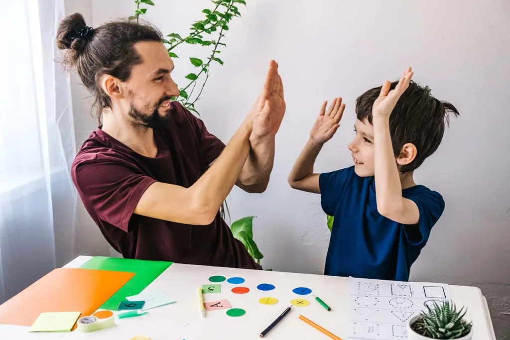 clinician and child playing a game demonstrating what is aba therapy